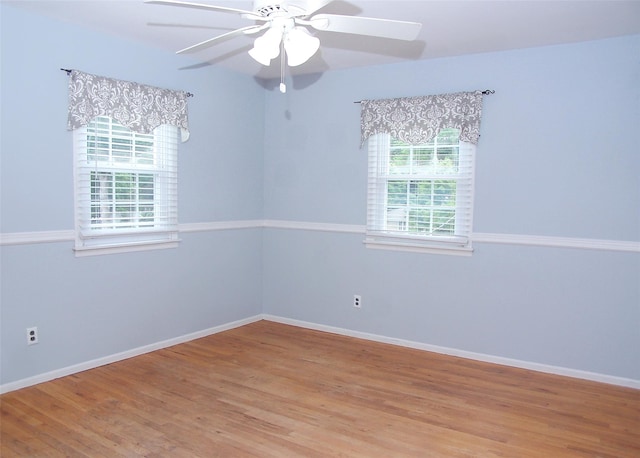 53 Admiral St, Port Jefferson Station, NY 11776 - empty room with wood finished floors, a ceiling fan, and baseboards
