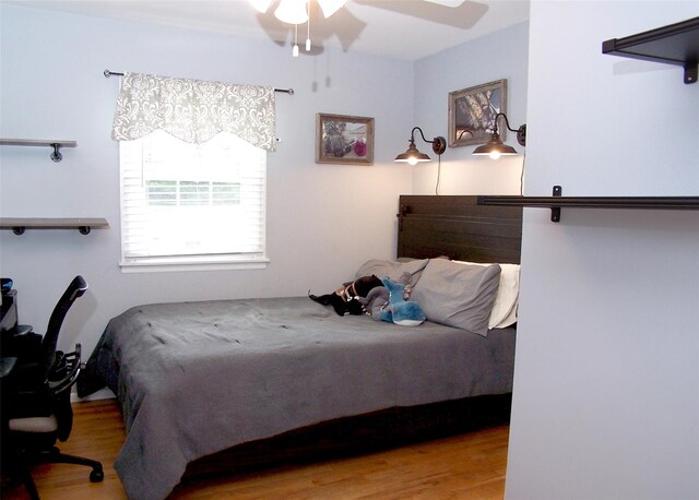 53 Admiral St, Port Jefferson Station, NY 11776 - bedroom with wood finished floors and a ceiling fan