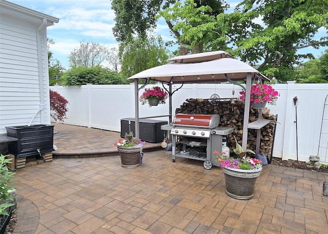 53 Admiral St, Port Jefferson Station, NY 11776 - fenced backyard featuring a patio, a grill, and a gazebo