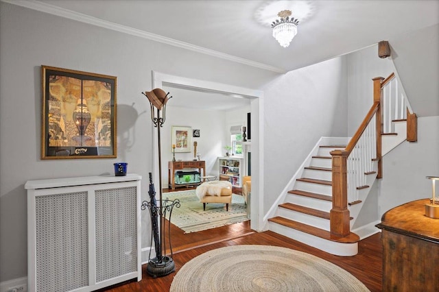 400 Manor Ridge Rd, Pelham, NY 10803 - entrance foyer with stairway, wood finished floors, a fireplace, and ornamental molding