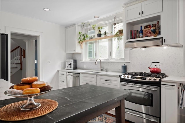 400 Manor Ridge Rd, Pelham, NY 10803 - kitchen with appliances with stainless steel finishes, open shelves, under cabinet range hood, white cabinetry, and tasteful backsplash
