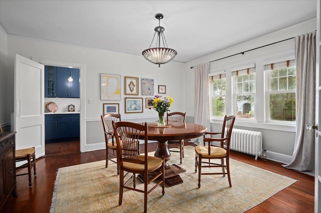 400 Manor Ridge Rd, Pelham, NY 10803 - dining space with radiator heating unit and dark wood-style floors