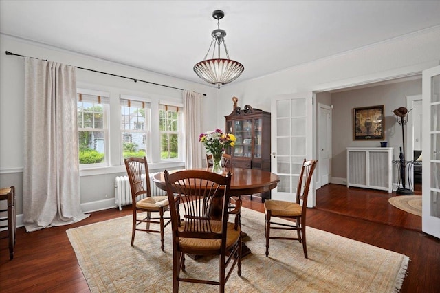 400 Manor Ridge Rd, Pelham, NY 10803 - dining room featuring radiator heating unit, french doors, and wood finished floors