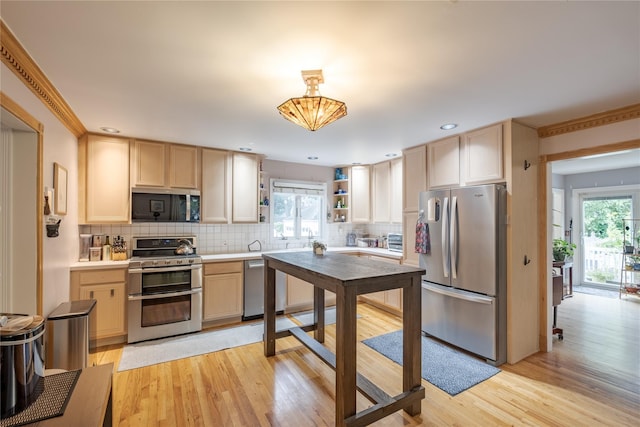 156 E Maujer St, Valley Stream, NY 11580 - kitchen with stainless steel appliances, plenty of natural light, open shelves, tasteful backsplash, and recessed lighting