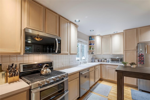 156 E Maujer St, Valley Stream, NY 11580 - kitchen with appliances with stainless steel finishes, tasteful backsplash, open shelves, light brown cabinetry, and recessed lighting