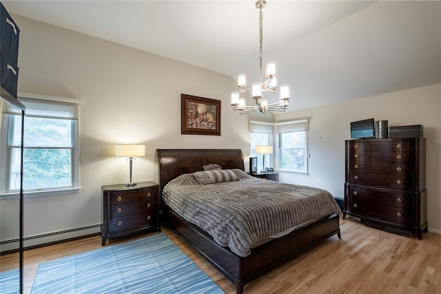 156 E Maujer St, Valley Stream, NY 11580 - bedroom with baseboard heating, a chandelier, light wood-type flooring, multiple windows, and lofted ceiling