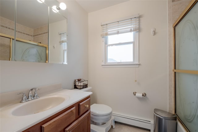 156 E Maujer St, Valley Stream, NY 11580 - bathroom featuring a baseboard radiator, a shower with shower door, vanity, and tile patterned floors