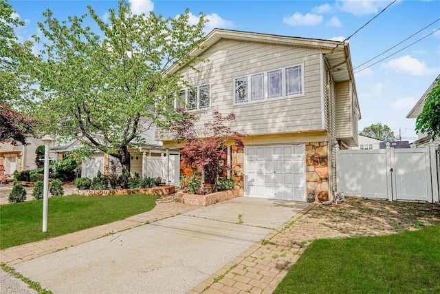 15 Oliver Pl, Staten Island, NY 10314 - view of front of property with a gate, an attached garage, driveway, and stone siding