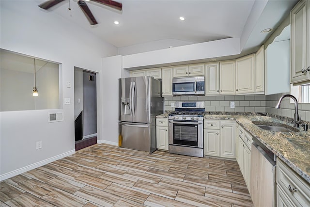 15 Oliver Pl, Staten Island, NY 10314 - kitchen with appliances with stainless steel finishes, a sink, a ceiling fan, tasteful backsplash, and wood finish floors