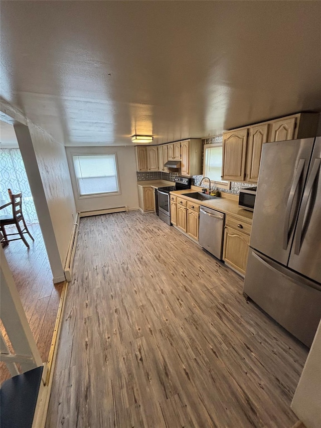 103 Continental Rd, Napanoch, NY 12458 - kitchen featuring appliances with stainless steel finishes, wood finished floors, a sink, under cabinet range hood, and light brown cabinets