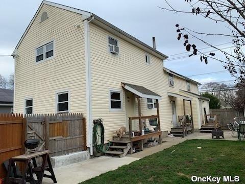 1938 Meadowbrook Rd, Merrick, NY 11566 - back of house with a patio and a wooden deck