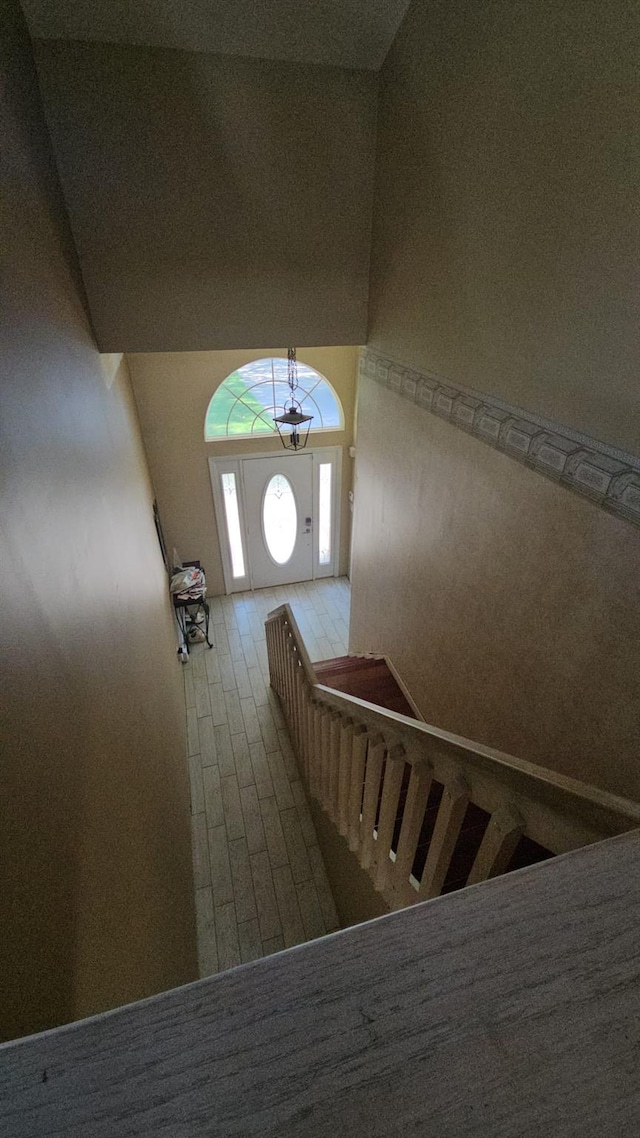 943 Macarthur St, Bohemia, NY 11716 - stairway featuring lofted ceiling and wood finished floors