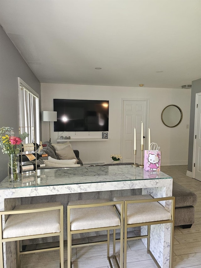943 Macarthur St, Bohemia, NY 11716 - living area featuring baseboards and wood finished floors