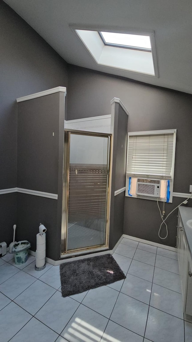 943 Macarthur St, Bohemia, NY 11716 - full bathroom with lofted ceiling, cooling unit, a stall shower, tile patterned floors, and vanity