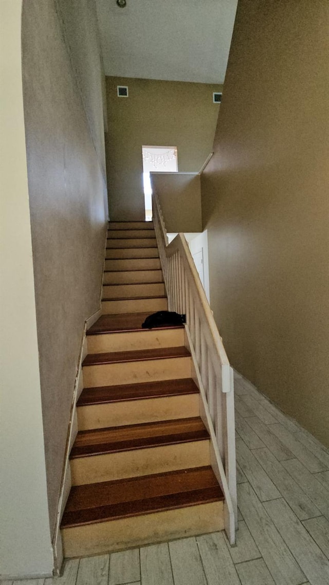 943 Macarthur St, Bohemia, NY 11716 - stairs featuring wood finished floors