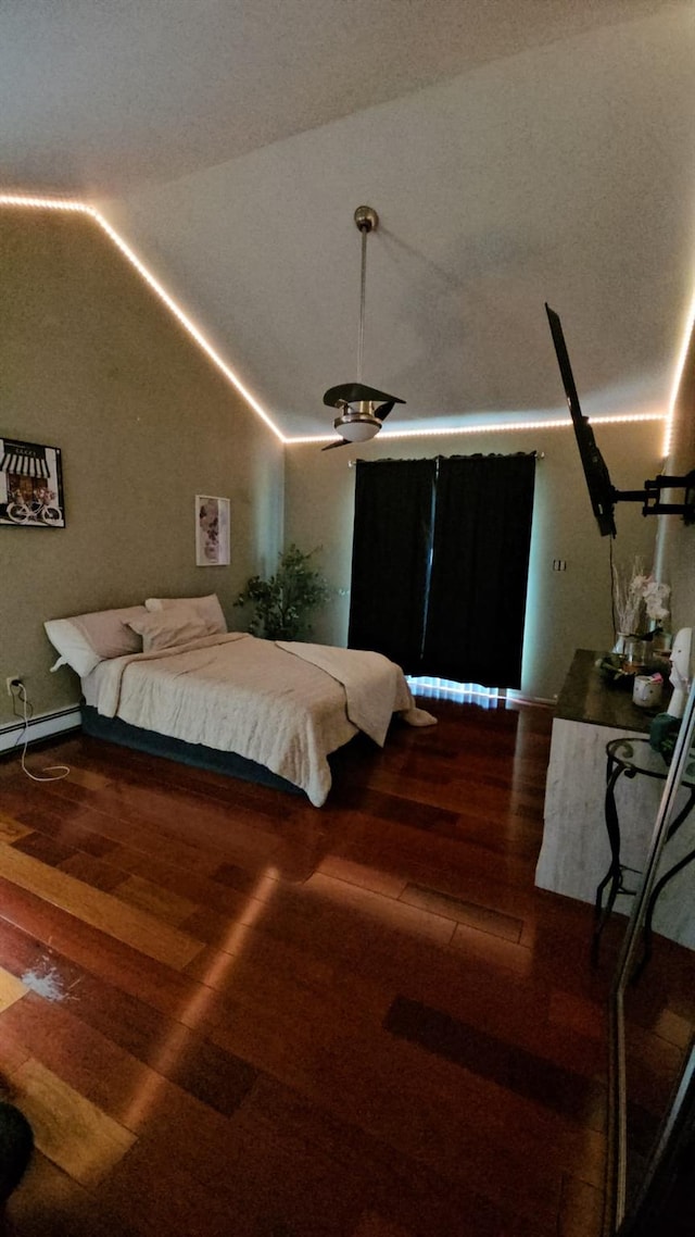 943 Macarthur St, Bohemia, NY 11716 - bedroom with lofted ceiling, wood finished floors, and baseboard heating