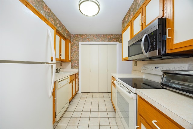 28 Amber Ct, Poughkeepsie, NY 12603 - kitchen featuring white appliances, light countertops, a sink, wallpapered walls, and glass insert cabinets