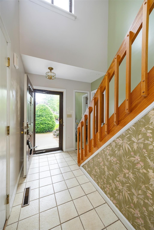 28 Amber Ct, Poughkeepsie, NY 12603 - entrance foyer with light tile patterned floors, stairs, and baseboards