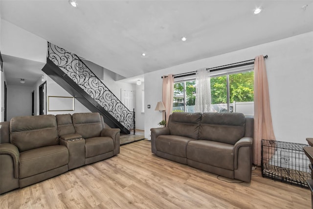 59 Oslo Dr, Yorktown Heights, NY 10598 - living room featuring light wood-style floors, stairs, vaulted ceiling, and recessed lighting
