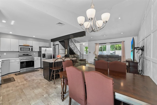 59 Oslo Dr, Yorktown Heights, NY 10598 - dining room with a chandelier, light wood-style flooring, recessed lighting, and baseboard heating