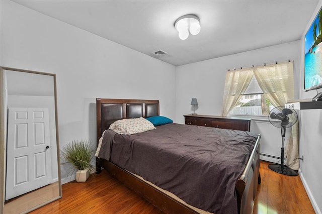 59 Oslo Dr, Yorktown Heights, NY 10598 - bedroom with wood finished floors, baseboards, and a baseboard heating unit