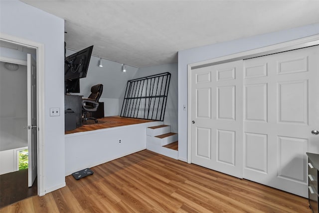 59 Oslo Dr, Yorktown Heights, NY 10598 - unfurnished bedroom featuring wood finished floors, an office area, and track lighting