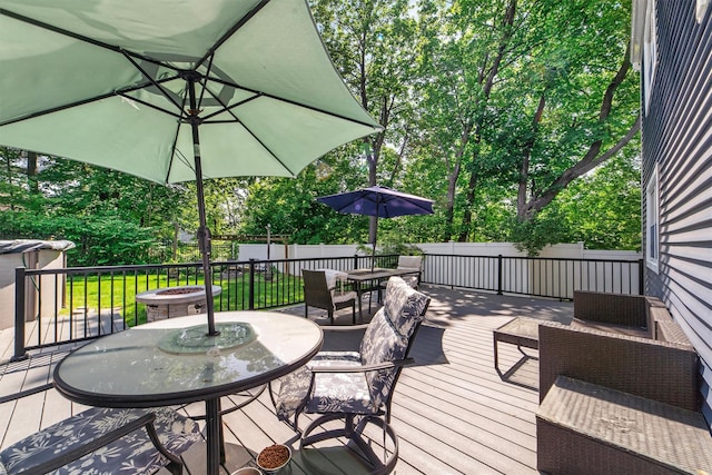 59 Oslo Dr, Yorktown Heights, NY 10598 - wooden deck with outdoor dining space and view of wooded area