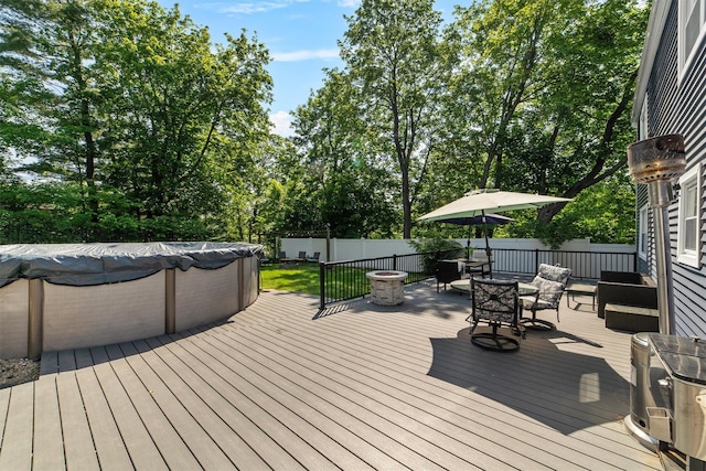 59 Oslo Dr, Yorktown Heights, NY 10598 - wooden terrace featuring a fenced backyard, outdoor dining space, and view of wooded area