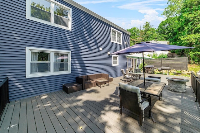 59 Oslo Dr, Yorktown Heights, NY 10598 - wooden deck with outdoor dining space and an outdoor living space with a fire pit