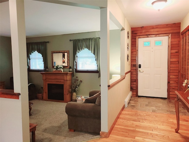 43 Last Rd, Montgomery, NY 10941 - foyer entrance featuring a baseboard heating unit, light wood-type flooring, plenty of natural light, and a fireplace