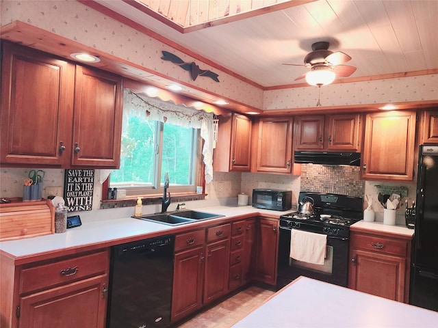 43 Last Rd, Montgomery, NY 10941 - kitchen with black appliances, under cabinet range hood, wallpapered walls, light countertops, and ceiling fan