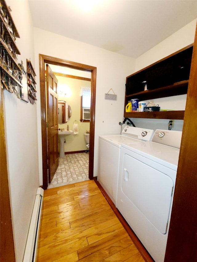 43 Last Rd, Montgomery, NY 10941 - laundry room with a baseboard radiator, washing machine and dryer, light wood-type flooring, and cooling unit