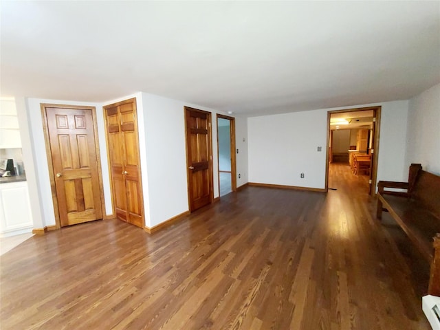 43 Last Rd, Montgomery, NY 10941 - unfurnished living room with wood finished floors and a baseboard heating unit