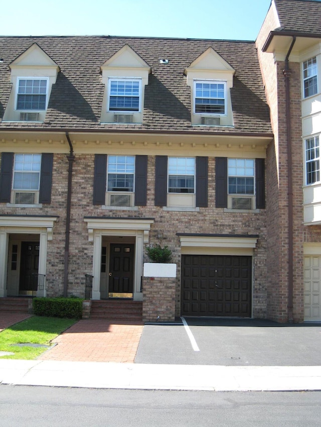 1404 Bonnie Ln Unit 15803, Bayside, NY 11360 - view of property with a garage, brick siding, and driveway