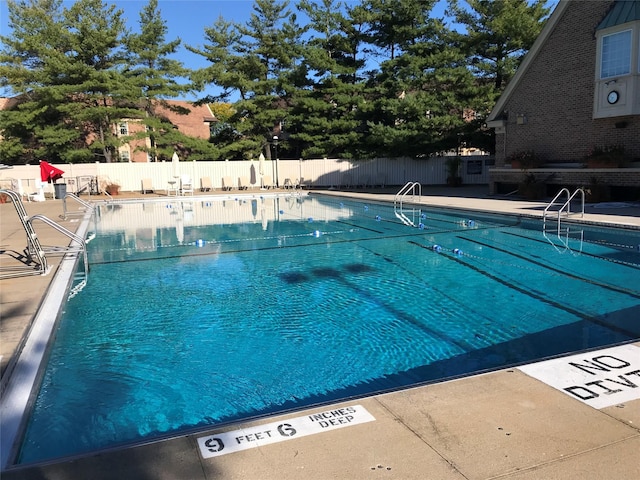 1404 Bonnie Ln Unit 15803, Bayside, NY 11360 - community pool featuring a patio
