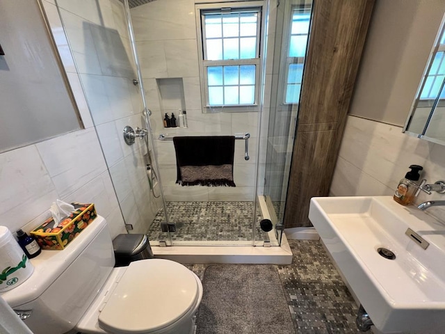 101 Oswego St, North Bellmore, NY 11710 - full bath featuring tile walls, toilet, a shower stall, a sink, and tile patterned floors