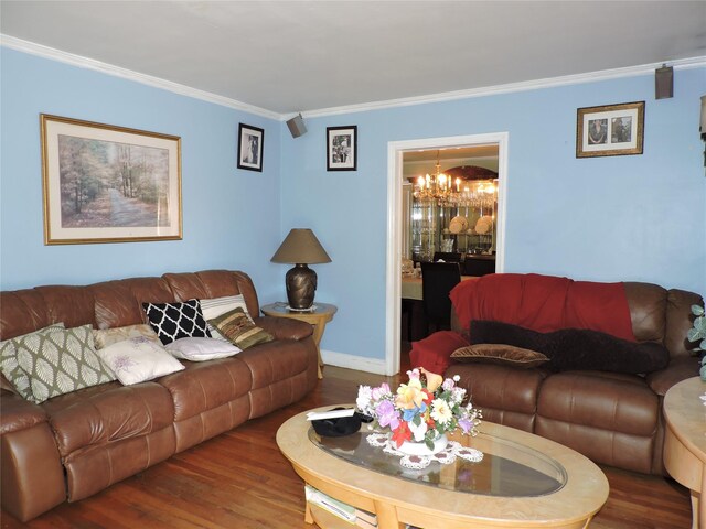 713 Colonial St, Uniondale, NY 11553 - living room featuring a chandelier, wood finished floors, and crown molding