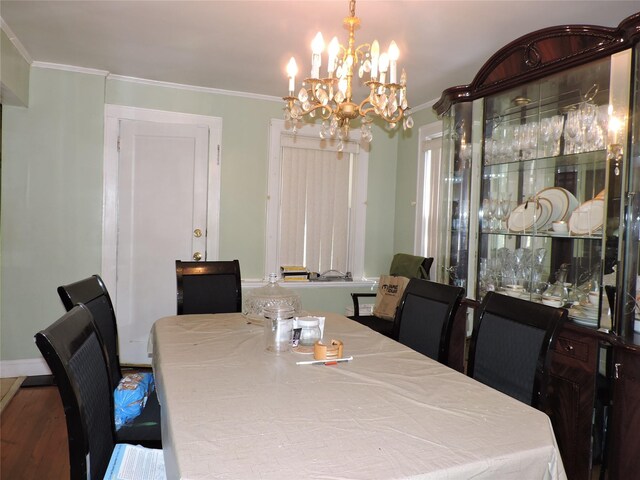 713 Colonial St, Uniondale, NY 11553 - dining space featuring a chandelier, crown molding, and wood finished floors