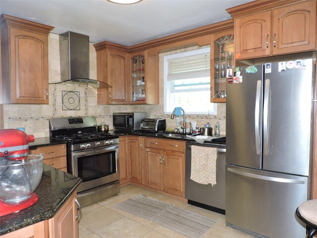 713 Colonial St, Uniondale, NY 11553 - kitchen featuring stainless steel appliances, wall chimney exhaust hood, a sink, and tasteful backsplash