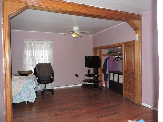 713 Colonial St, Uniondale, NY 11553 - home office with wood finished floors, ceiling fan, baseboards, and arched walkways