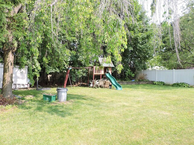 713 Colonial St, Uniondale, NY 11553 - view of yard featuring a playground