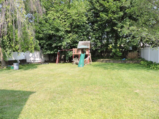 713 Colonial St, Uniondale, NY 11553 - view of yard with a playground