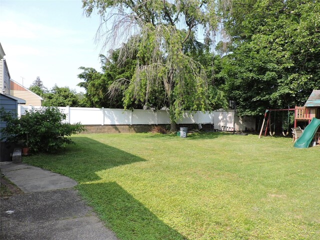 713 Colonial St, Uniondale, NY 11553 - view of yard featuring a playground