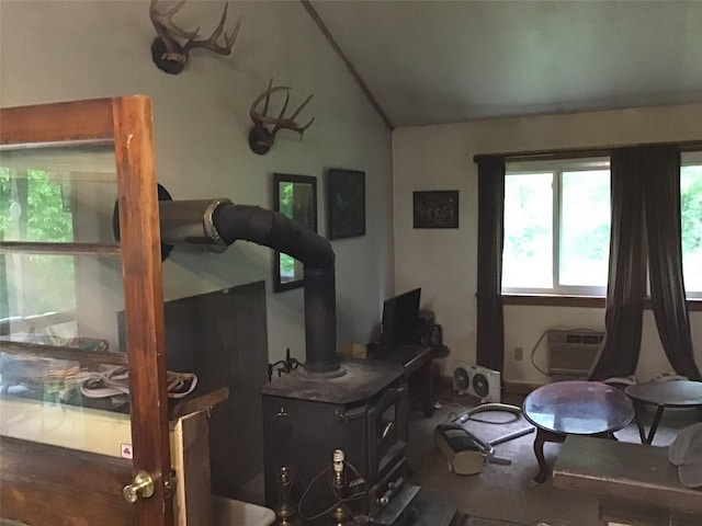 1814 Rte 199, Stanfordville, NY 12581 - bedroom featuring lofted ceiling, a wall mounted air conditioner, and a wood stove