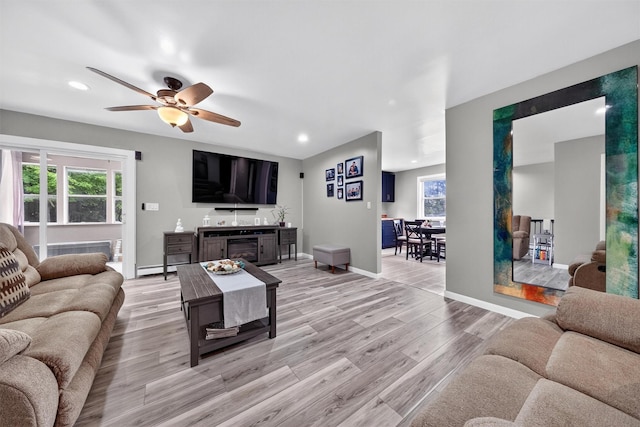 98 Greenhaven Rd, Poughquag, NY 12570 - living room with healthy amount of natural light, light wood finished floors, recessed lighting, baseboard heating, and ceiling fan