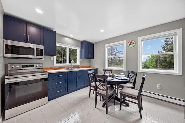 98 Greenhaven Rd, Poughquag, NY 12570 - kitchen featuring stainless steel appliances, blue cabinetry, plenty of natural light, light countertops, and recessed lighting