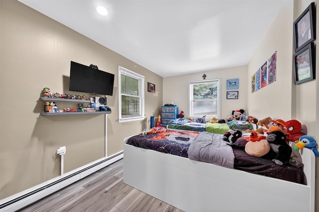 98 Greenhaven Rd, Poughquag, NY 12570 - bedroom featuring a baseboard radiator and wood finished floors