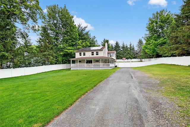 98 Greenhaven Rd, Poughquag, NY 12570 - view of front of property with solar panels, a chimney, and a sunroom
