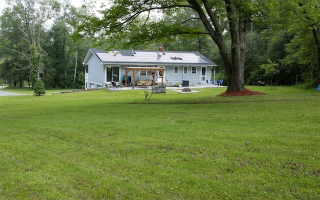 52 Old Chester Rd, Goshen, NY 10924 - back of house featuring an outdoor fire pit, a patio area, and a lawn