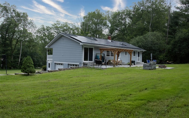 52 Old Chester Rd, Goshen, NY 10924 - back of house with an attached garage, a patio area, a yard, and a chimney